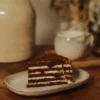 Chocolate Honey Cake Slice with Cherries Slice of chocolate honey cake with cherry filling