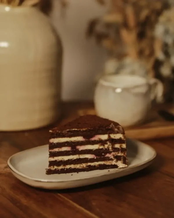 Chocolate Honey Cake Slice with Cherries Slice of chocolate honey cake with cherry filling