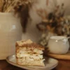 Slice of Kyiv Cake with nutty meringue and buttercream