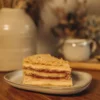 Pistachio Napoleon Slice with Raspberry Slice of Napoleon with raspberry on a plate