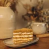Slice of Honey Cake Orange with orange curd and cream